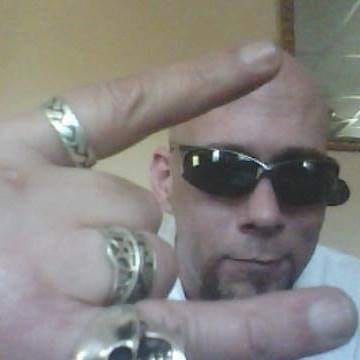Man in sunglasses posing toward the camera